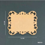 Small rectangular MDF plaque blank with ornate corner cut‑outs, measuring 7.8 × 6.5 cm, displayed on a dark teal background.