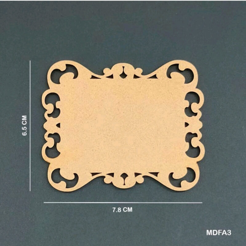 Small rectangular MDF plaque blank with ornate corner cut‑outs, measuring 7.8 × 6.5 cm, displayed on a dark teal background.