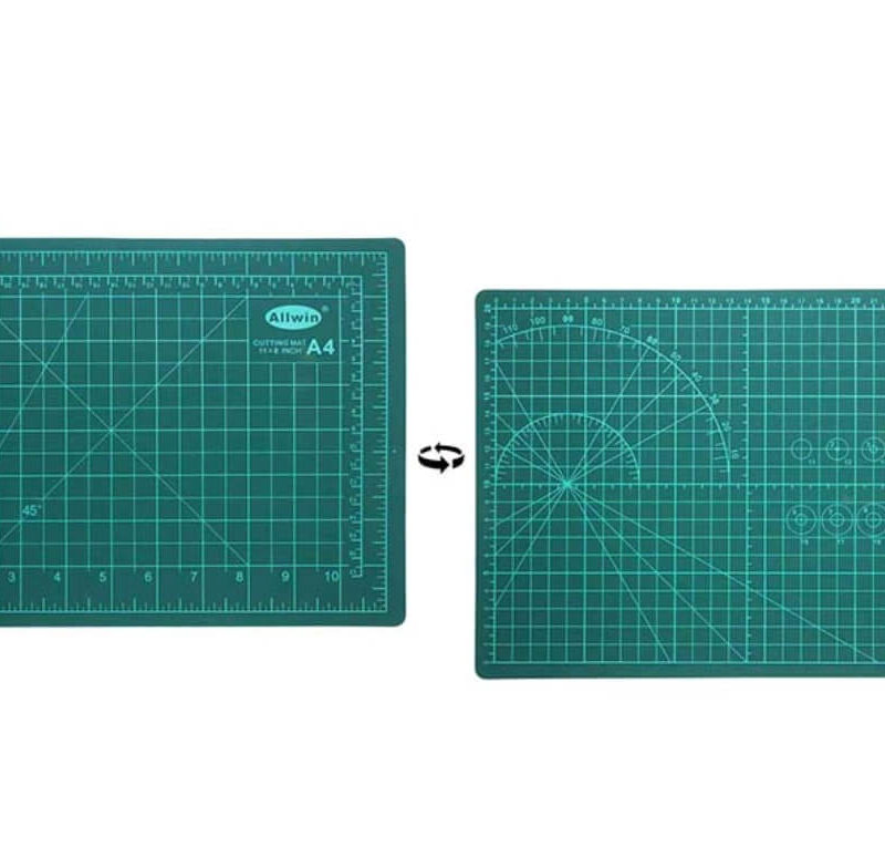 Green A4-size self-healing double-sided cutting mat with grid and angle guides.