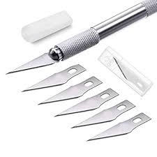 Precision craft knife with metal grip and 5 extra replaceable blades for cutting.
