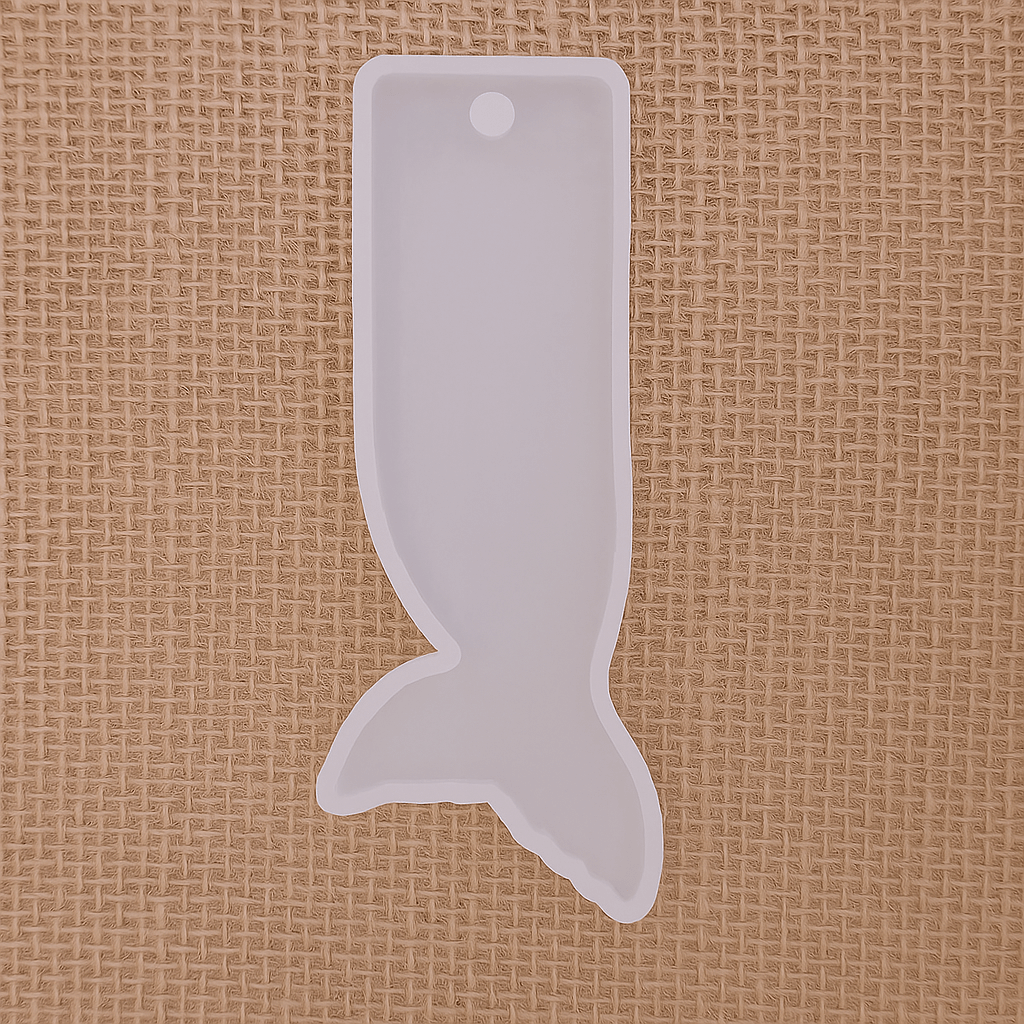 Silicone mold in the shape of a whale tail bookmark, ideal for resin casting and DIY crafts.