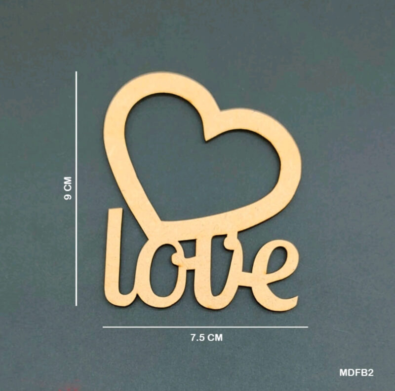 MDF embellishment featuring the word "love" with integrated heart design