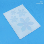 “18.6cm x 24.7cm silicone mould with 4 flower cavities for resin art, coaster making, jewellery, and home decor.”